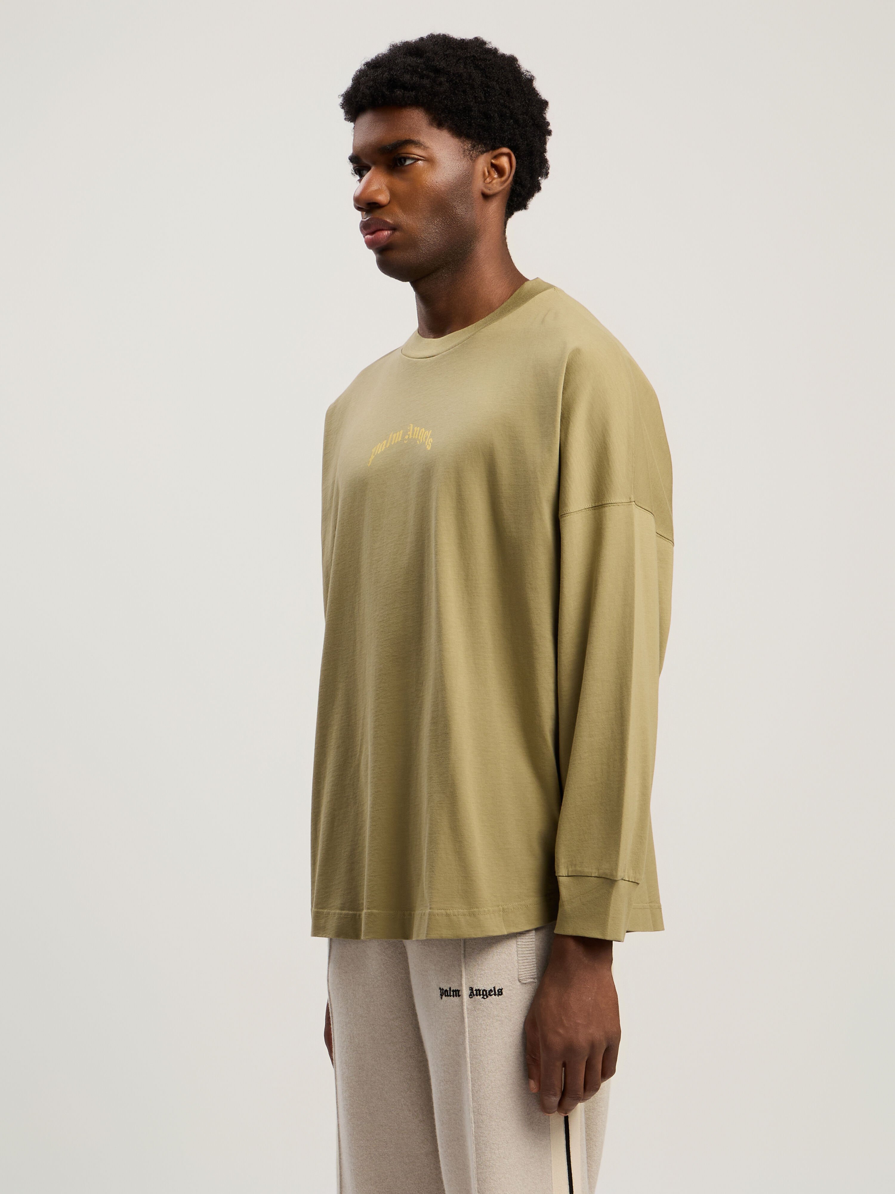 Curved Logo Long Sleeve T-Shirt PALM ANGELS Curved Logo Long Sleeve T-Shirt ARMY GREEN - YELLOW PMAB059F25JER001