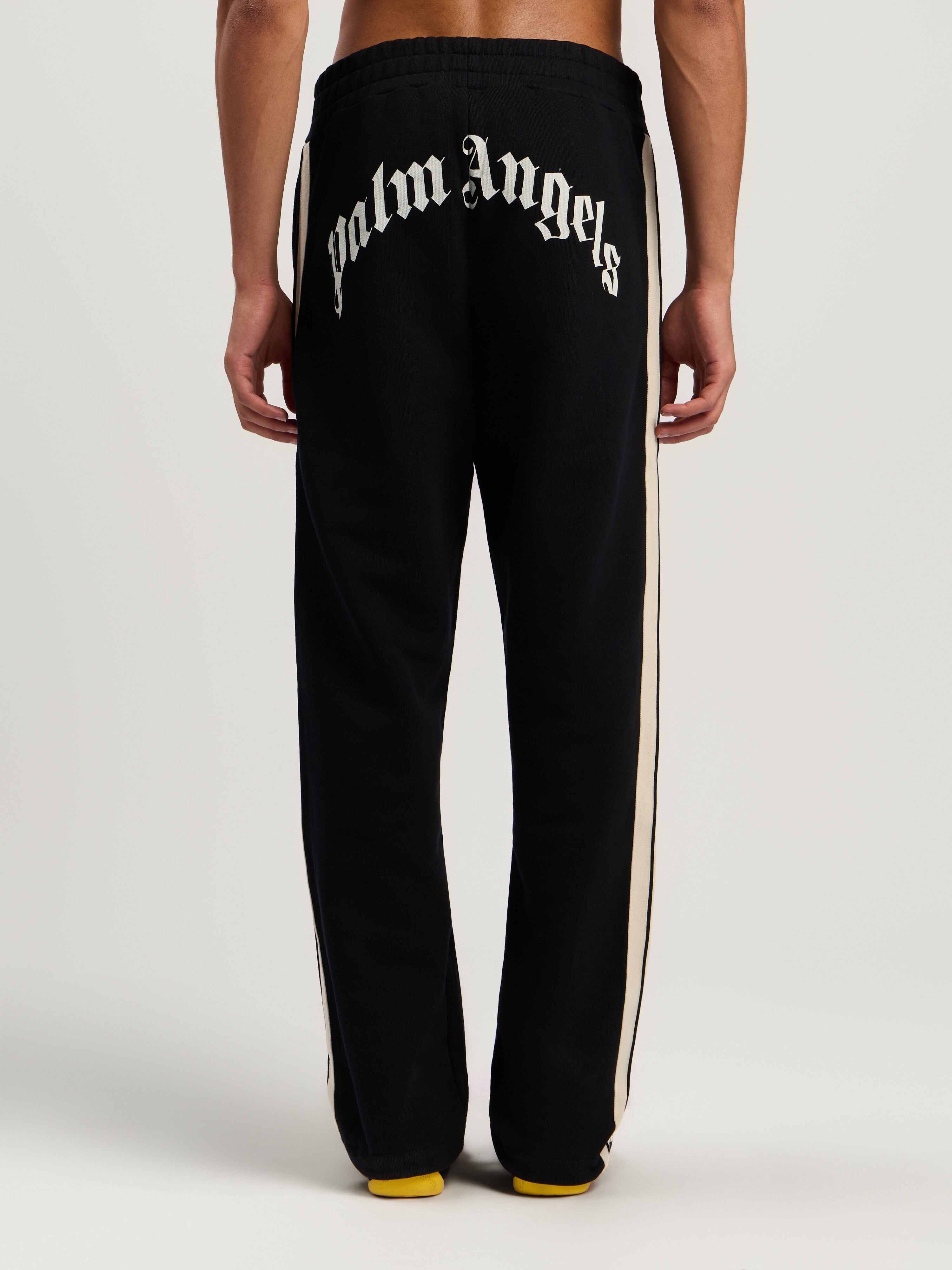 Curved Logo Track Sweatpants PALM ANGELS Curved Logo Track Sweatpants BLACK - OFF WHITE PMCH02KF25FLE001