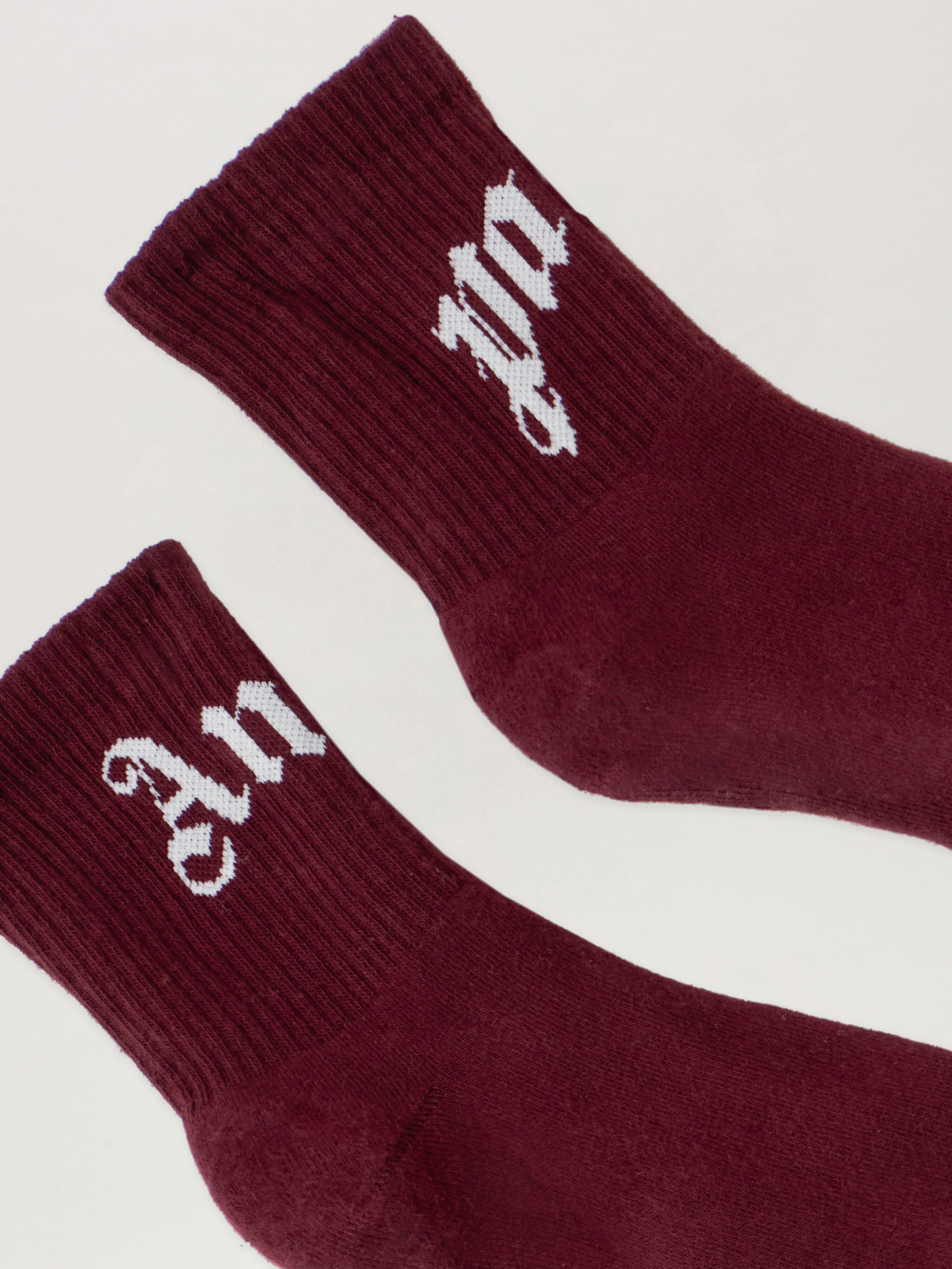 Curved Logo Socks PALM ANGELS Curved Logo Socks BURGUNDY - OFF WHITE PMRA008F25FAB001