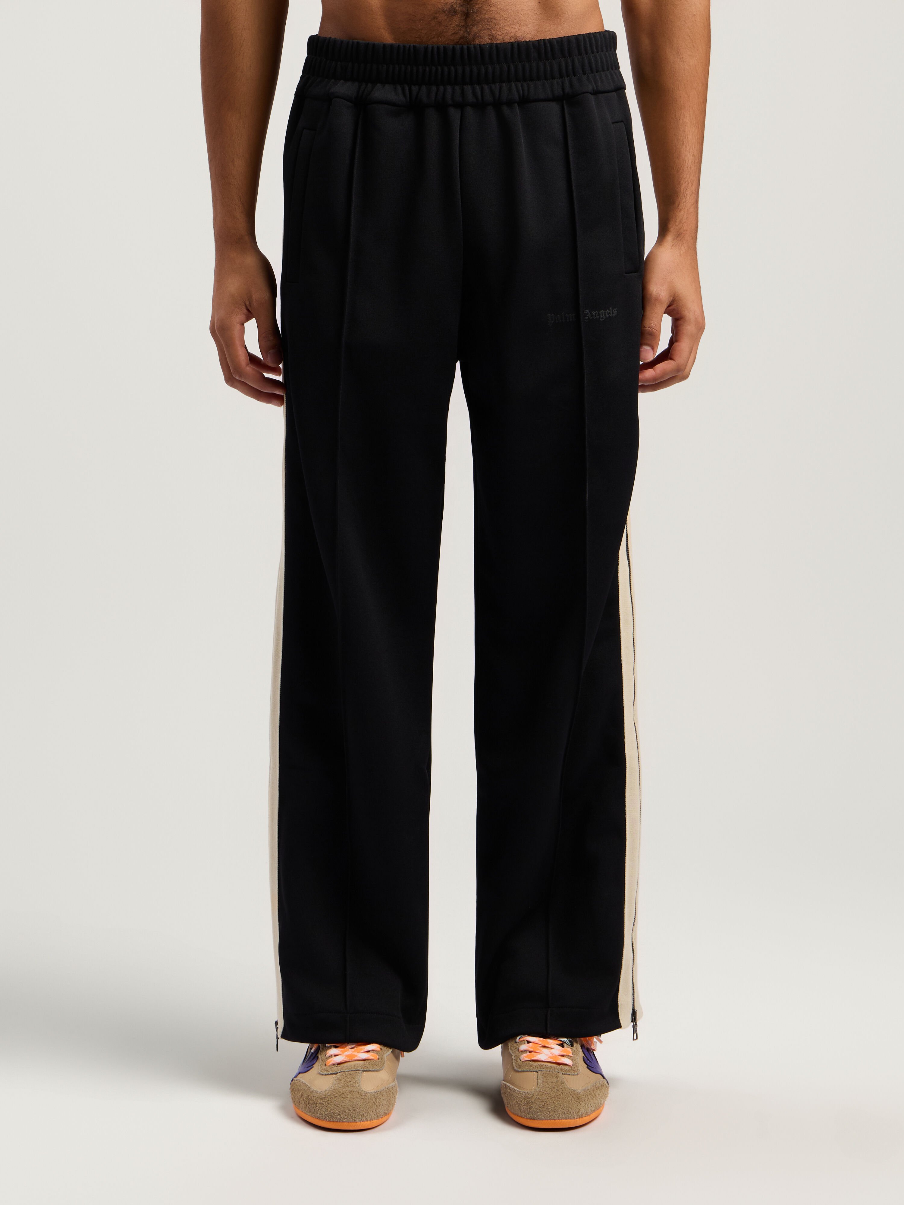 Performance Zip-Up Track Pants PALM ANGELS Performance Zip-Up Track Pants BLACK - ORANGE PMCJ04EF25FAB001