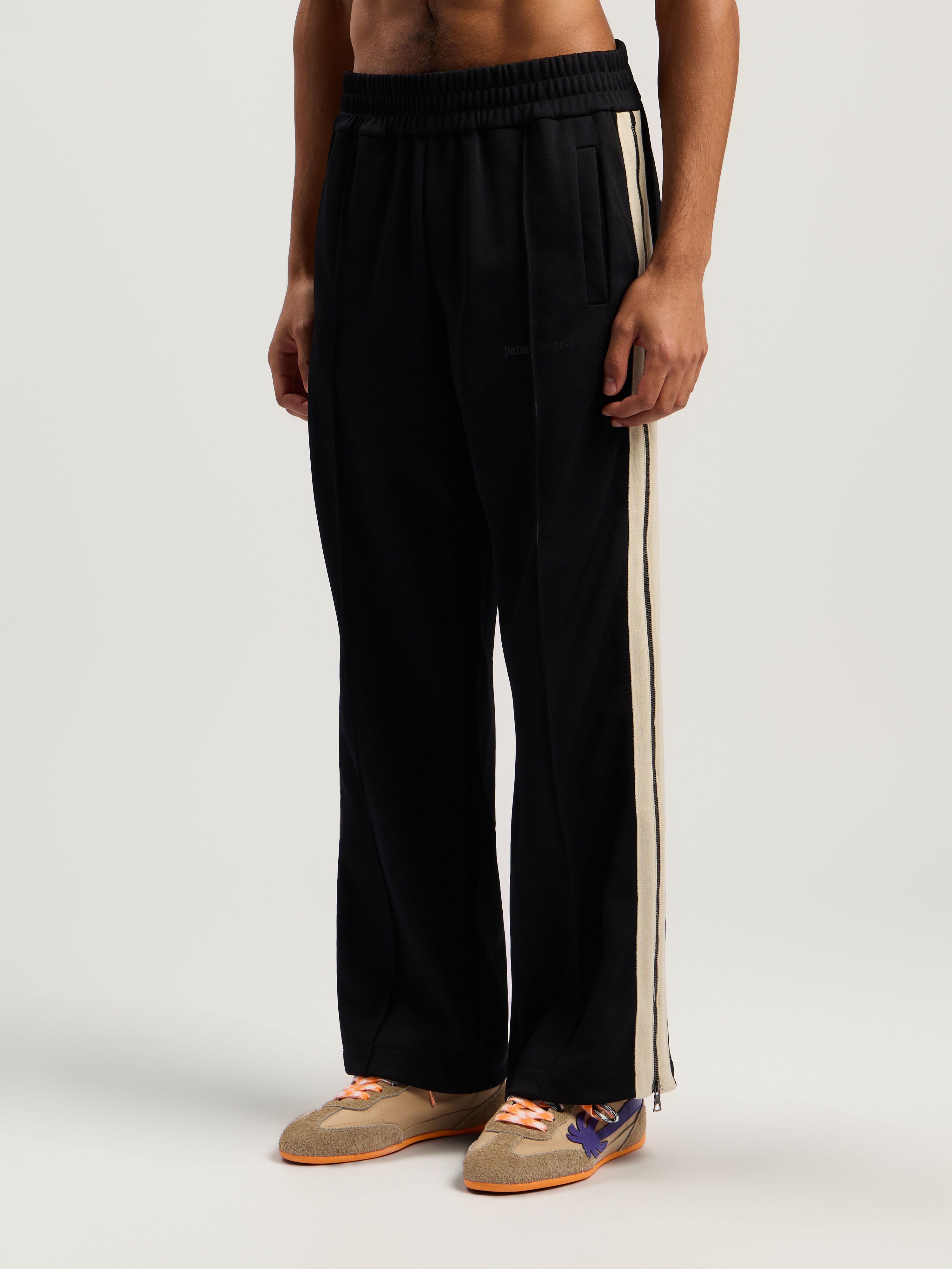 Performance Zip-Up Track Pants PALM ANGELS Performance Zip-Up Track Pants BLACK - ORANGE PMCJ04EF25FAB001