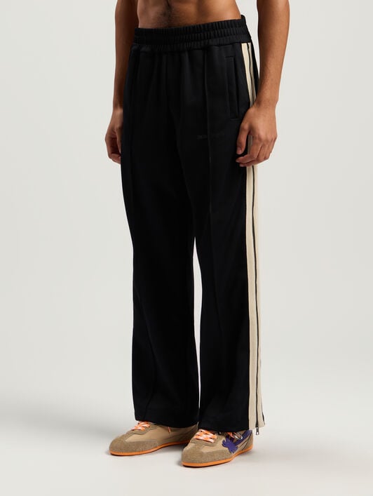 Performance Zip-Up Track Pants PALM ANGELS Performance Zip-Up Track Pants BLACK - ORANGE PMCJ04EF25FAB001